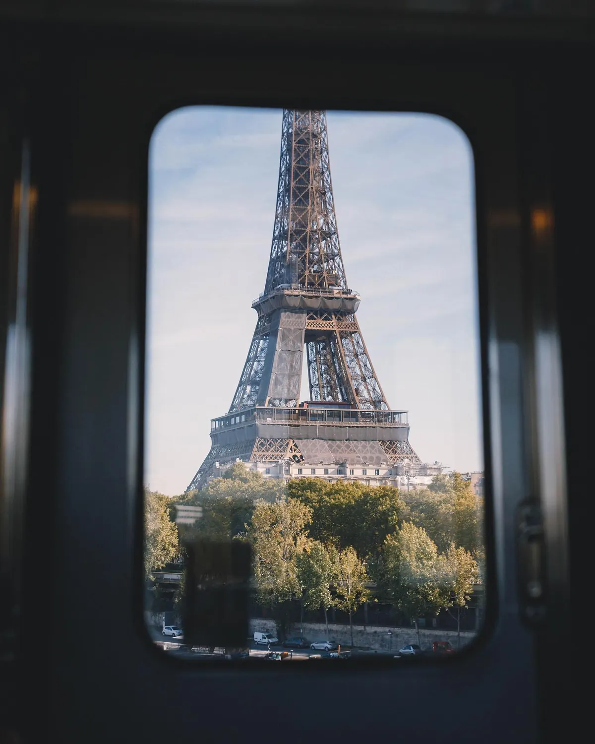 Eiffel Tower framed through a window