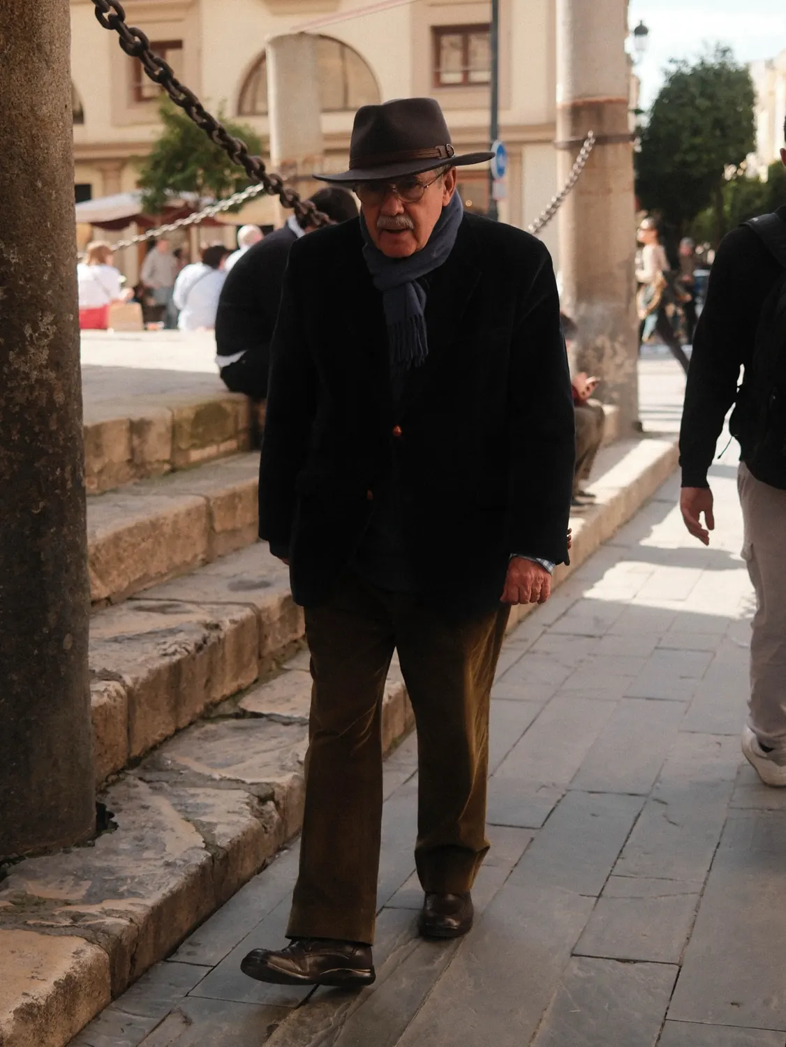 Street portrait of an older man wearing a hat